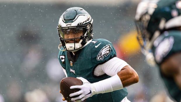 Jalen Hurs warms up prior to Week 4 vs. Jaguars in the rain and wind